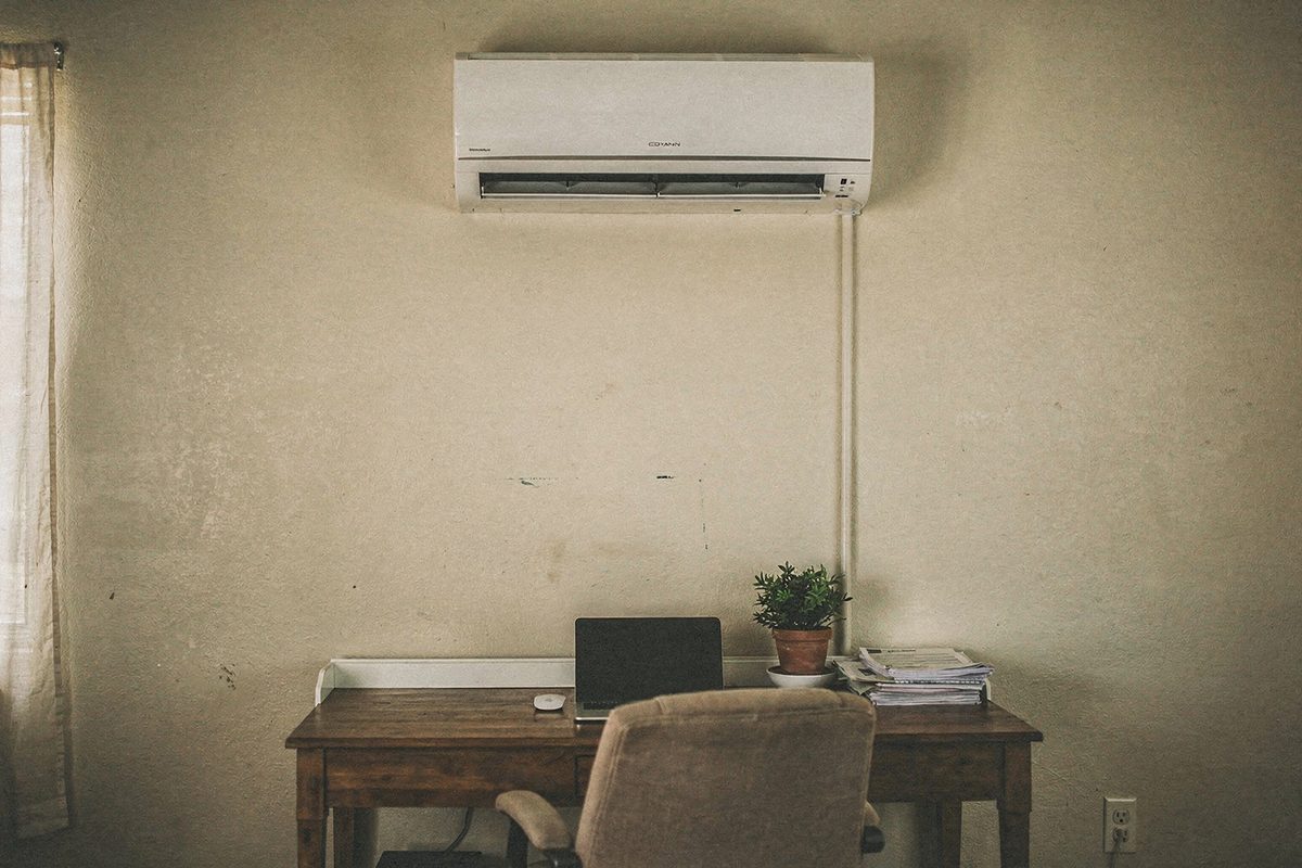 Finished ductless mini-split indoor unit mounted on a home office wall